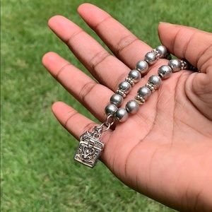 Vintage charm bracelet with small opening box.
